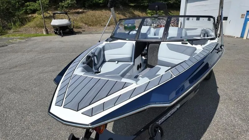 Slide: The Image of 2025 Malibu TXi boat with sleek design and luxurious interior. - 7