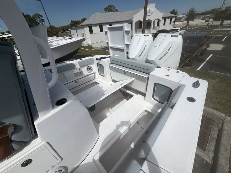 Slide: The Image of Sportsman Open 322 Center Console 2026 with Mercury engines at dock. - 13