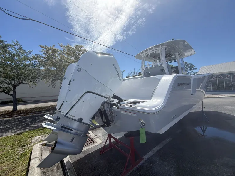 Slide: The Image of 2026 Sportsman Open 322 Center Console boat displayed outdoors. - 15