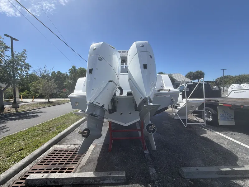 Slide: The Image of 2026 Sportsman Open 322 Center Console with dual outboard engines. - 16