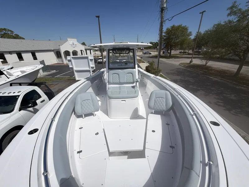 Slide: The Image of 2026 Sportsman Open 322 Center Console boat in parking lot. - 17