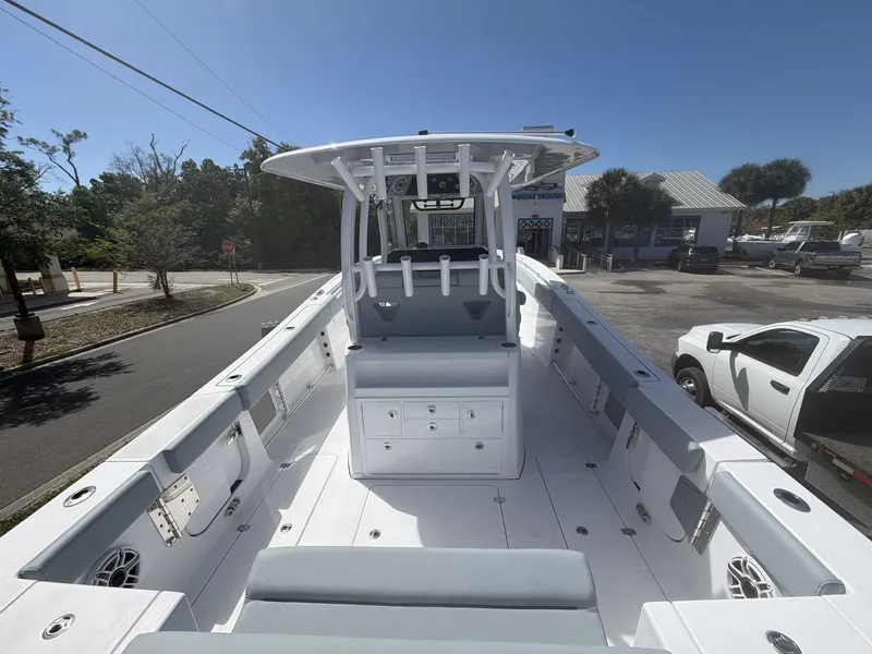 Slide: The Image of 2026 Sportsman Open 322 Center Console boat in parking lot. - 18