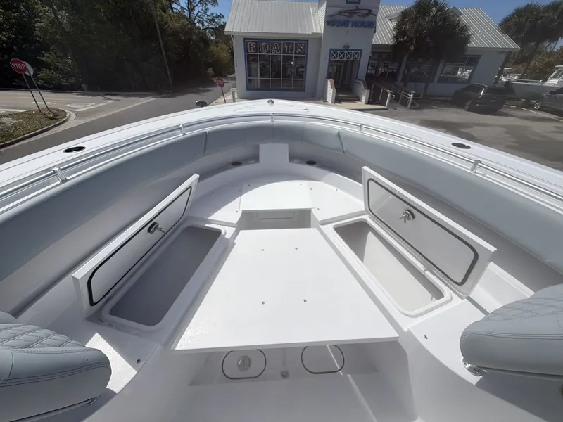 Slide: The Image of 2026 Sportsman Open 322 Center Console boat with storage compartments. - 20
