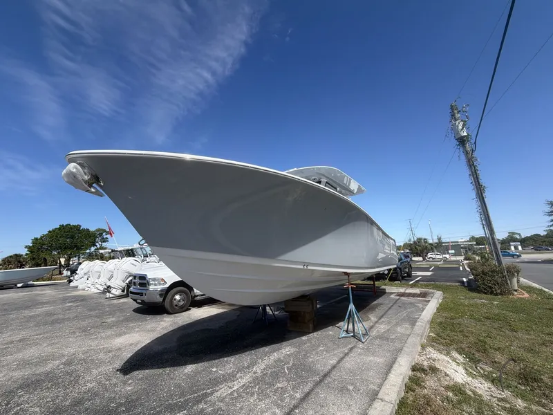 Slide: The Image of 2026 Sportsman Open 322 Center Console on a parking lot. - 3