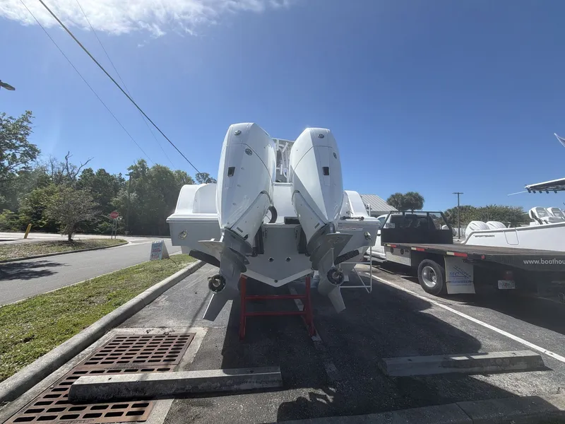 Slide: The Image of 2026 Sportsman Open 322 Center Console with dual outboard engines. - 6