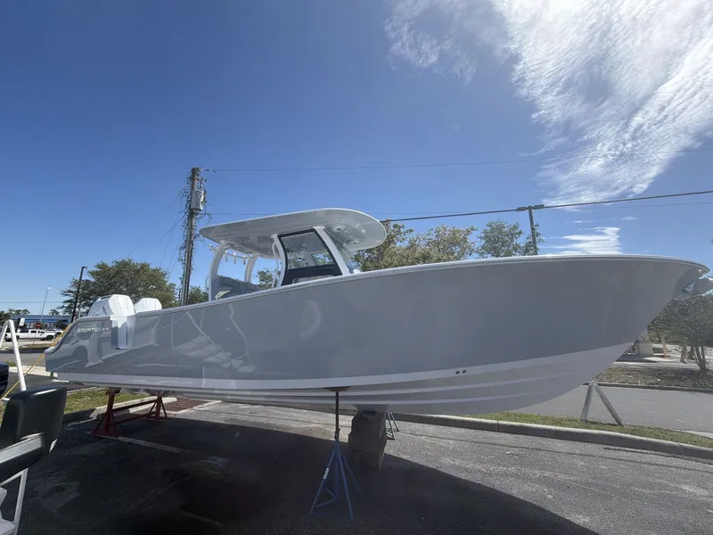 Slide: The Image of 2026 Sportsman Open 322 Center Console boat outdoors. - 8