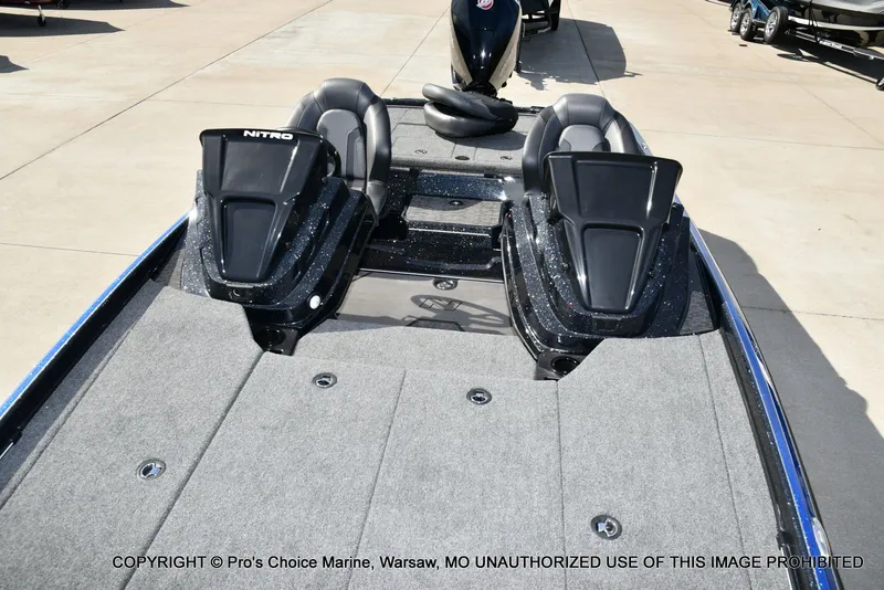 Slide: The Image of 2025 Nitro Z21 XL Pro Dual Console boat on concrete surface. - 15