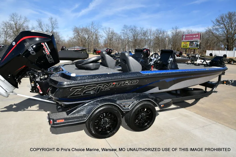 Slide: The Image of 2025 Nitro Z21 XL Pro Dual Console boat on trailer. - 22