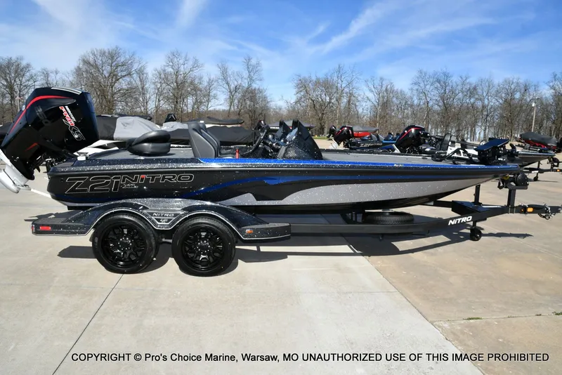 Slide: The Image of 2025 Nitro Z21 XL Pro Dual Console boat on trailer. - 23