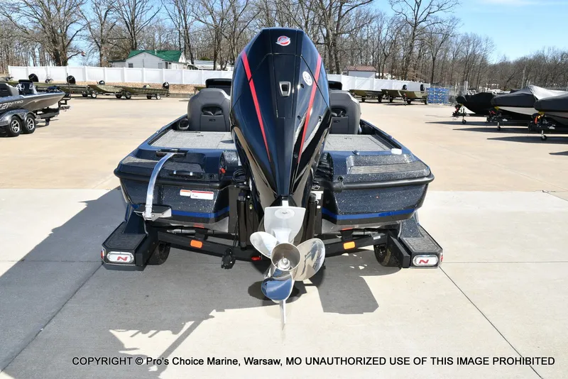 Slide: The Image of 2025 Nitro Z21 XL Pro Dual Console boat in parking lot. - 26