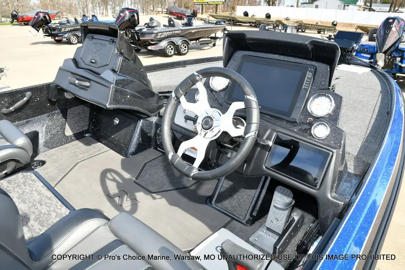 Slide: The Image of Interior of 2025 Nitro Z21 XL Pro Dual Console with steering console. - 8