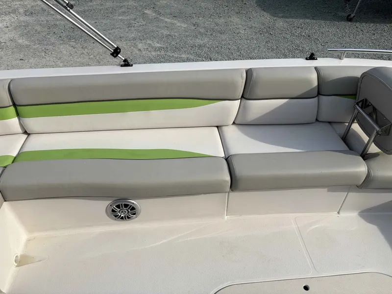 Slide: The Image of Interior of a 2017 Starcraft MDX 191 boat with gray and green seating. - 10