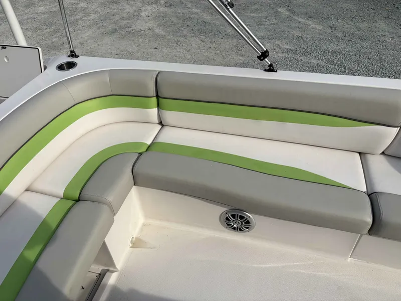 Slide: The Image of 2017 Starcraft MDX 191 boat seating with gray and green upholstery. - 11