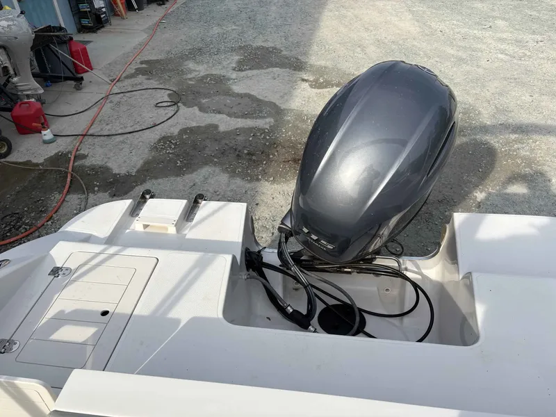 Slide: The Image of 2017 Starcraft MDX 191 boat with outboard motor on gravel surface. - 15