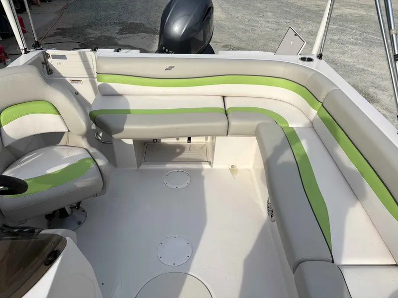 Slide: The Image of Interior of a 2017 Starcraft MDX 191 boat with green accents. - 9