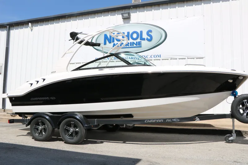 The Image of 2026 Chaparral 21 SSi boat on trailer outside a building. - 1