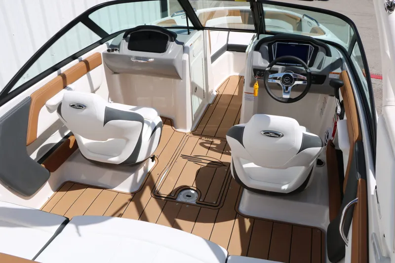 Slide: The Image of Interior of 2026 Chaparral 21 SSi with modern seating and steering wheel. - 21