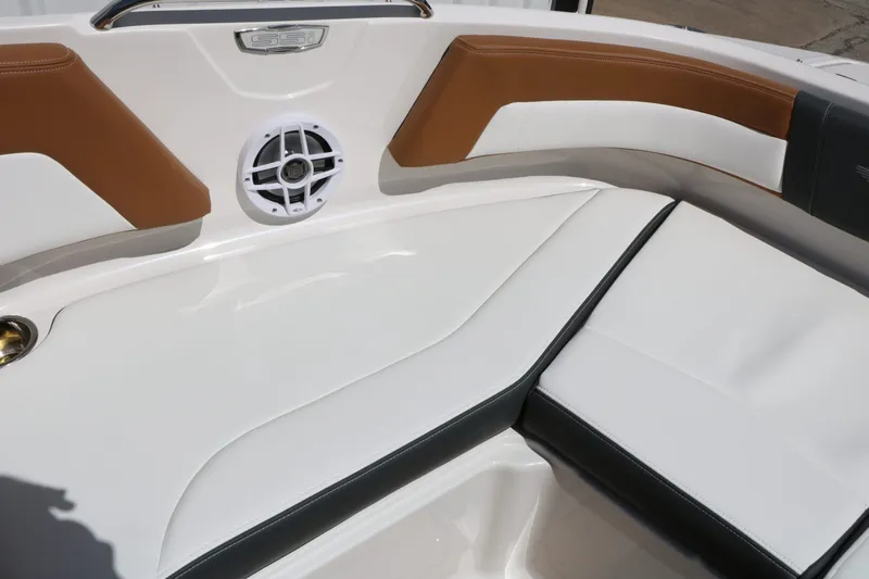 Slide: The Image of Interior of 2026 Chaparral 21 SSi with brown and white seating. - 27