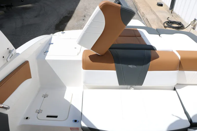 Slide: The Image of Interior of 2026 Chaparral 21 SSi with brown and white seating. - 38
