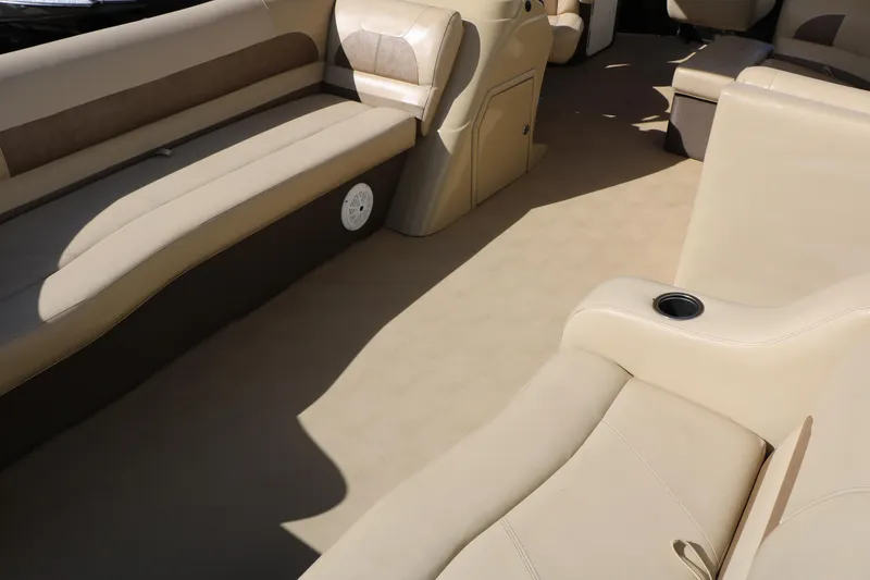 Slide: The Image of Interior of a 2020 Crest Classic Fish 200 boat with beige seating. - 14