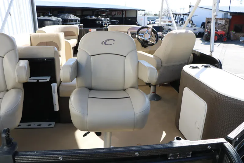 Slide: The Image of Interior of 2020 Crest Classic Fish 200 boat with beige seating and steering console. - 19