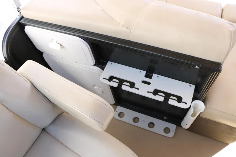 Slide: The Image of Interior of 2020 Crest Classic Fish 200 boat with beige seating and storage compartments. - 24