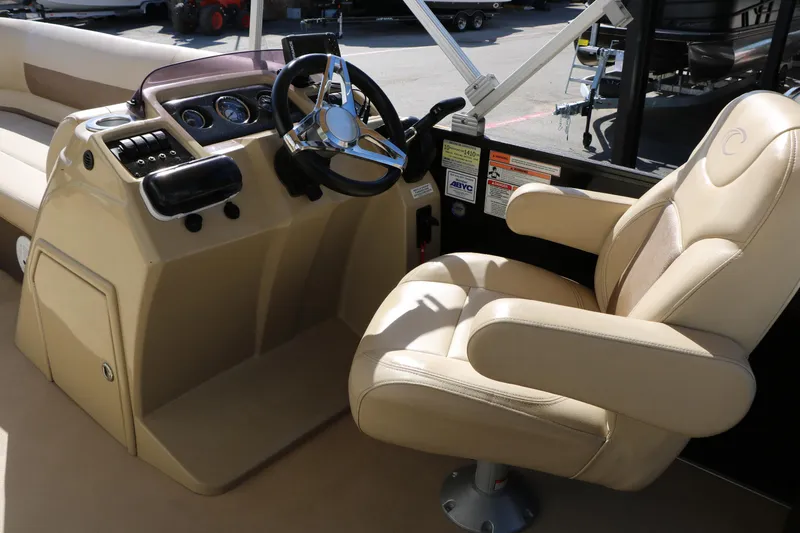 Slide: The Image of 2020 Crest Classic Fish 200 boat interior with steering console and captain's chair. - 25
