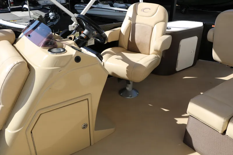 Slide: The Image of Interior of a 2020 Crest Classic Fish 200 boat with beige seating and steering console. - 29
