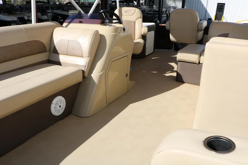 Slide: The Image of Interior of a 2020 Crest Classic Fish 200 pontoon boat with beige seating. - 30