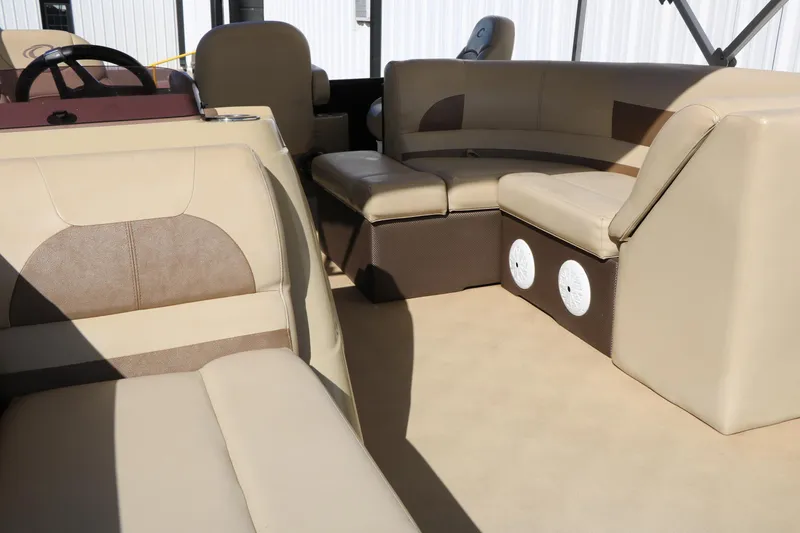 Slide: The Image of Interior of 2020 Crest Classic Fish 200 pontoon boat with beige seating. - 31