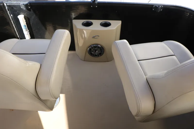 Slide: The Image of Interior of 2020 Crest Classic Fish 200 boat with beige seating and cup holders. - 32