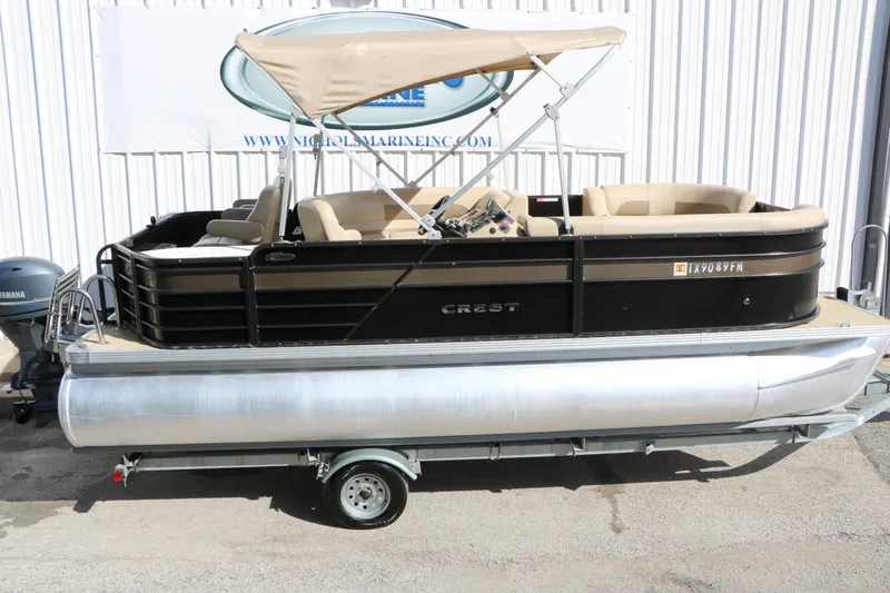 Slide: The Image of 2020 Crest Classic Fish 200 pontoon boat with canopy on trailer. - 9
