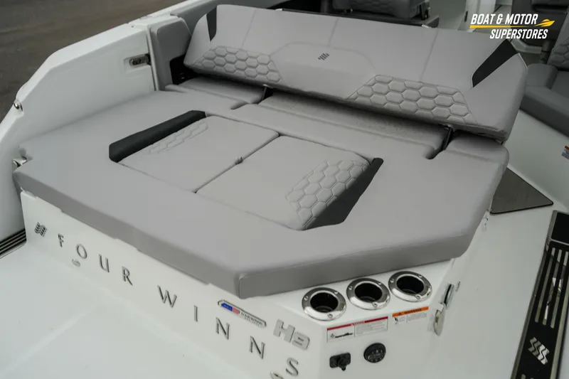 Slide: The Image of 2026 Four Winns H9 OB boat with gray seating and cup holders. - 25