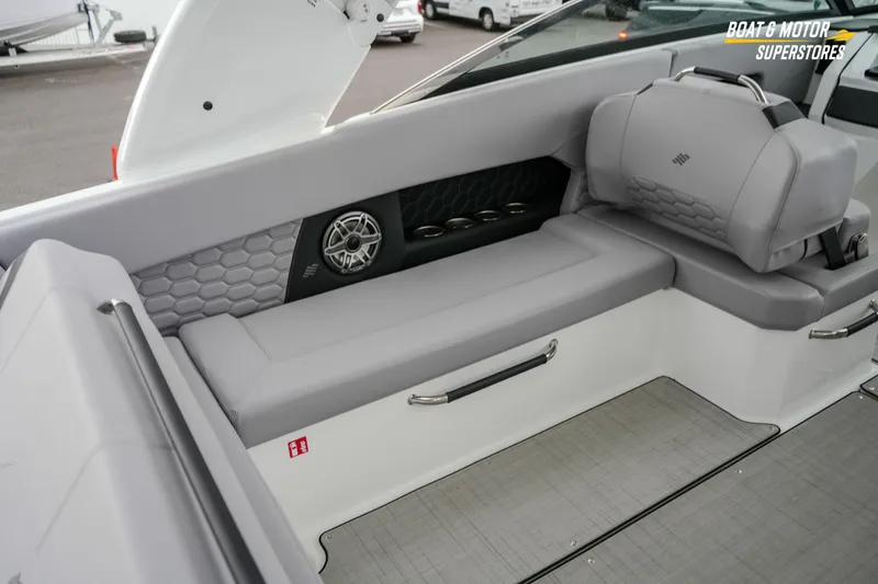Slide: The Image of 2026 Four Winns H9 OB boat interior with gray seating and speaker detail. - 29