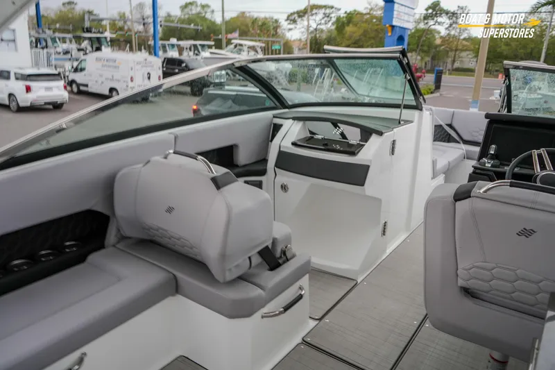 Slide: The Image of 2026 Four Winns H9 OB boat interior with modern seating and sleek dashboard design. - 30