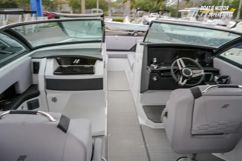 Slide: The Image of 2026 Four Winns H9 OB boat interior with modern helm and seating. - 31