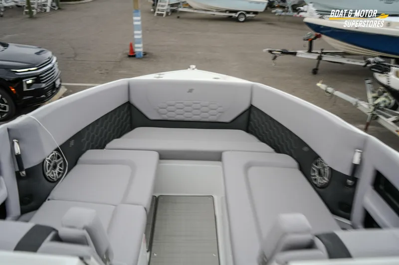 Slide: The Image of 2026 Four Winns H9 OB boat interior with gray seating and modern design. - 36