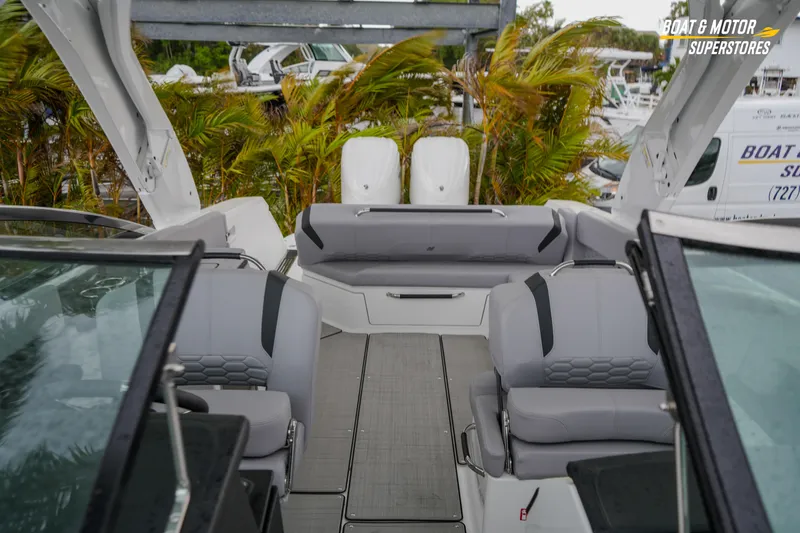 Slide: The Image of 2026 Four Winns H9 OB boat interior with gray seating and modern design. - 37