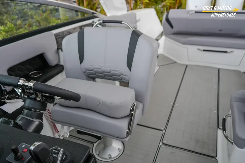 Slide: The Image of 2026 Four Winns H9 OB boat interior with modern seating and steering console. - 38