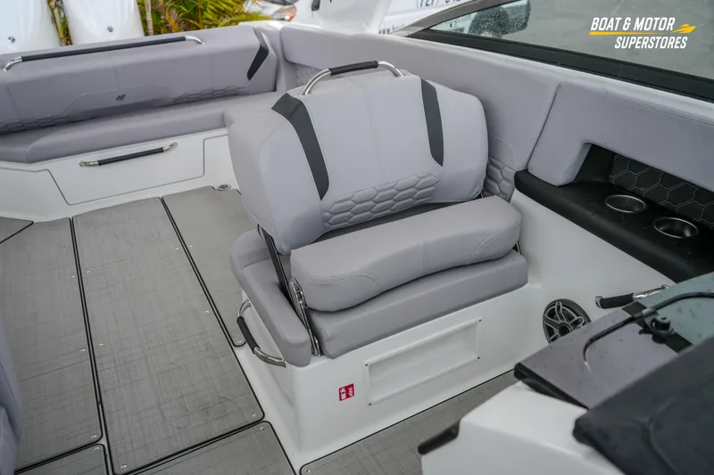 Slide: The Image of 2026 Four Winns H9 OB boat interior with gray seating and modern design elements. - 39