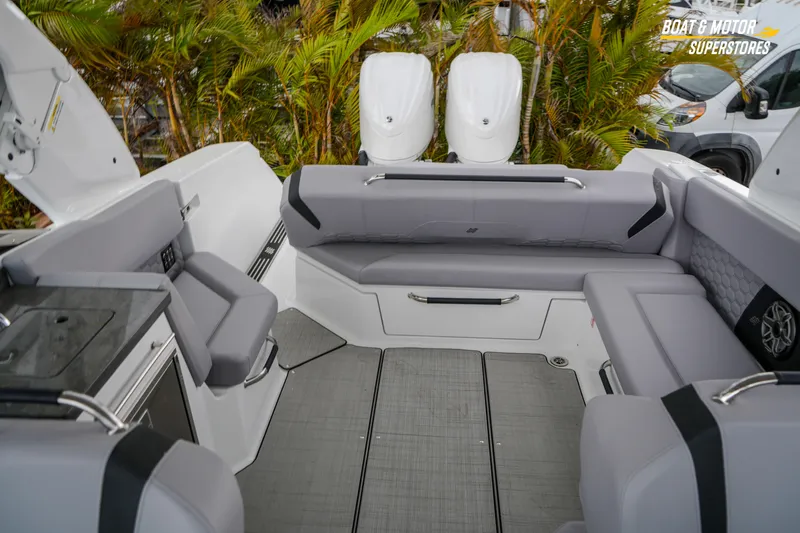Slide: The Image of Interior of 2026 Four Winns H9 OB boat with gray seating and modern design. - 40