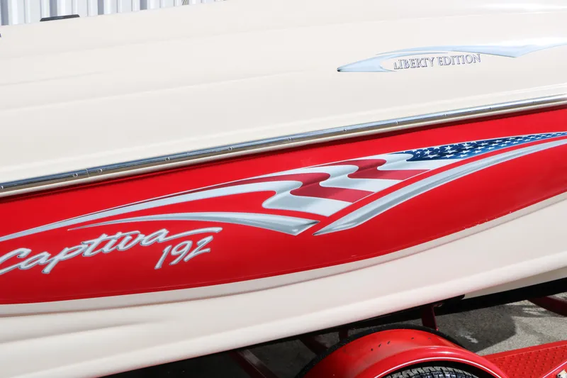 Slide: The Image of 2002 Rinker 192 Captiva Bowrider, Liberty Edition, red and white design detail. - 13