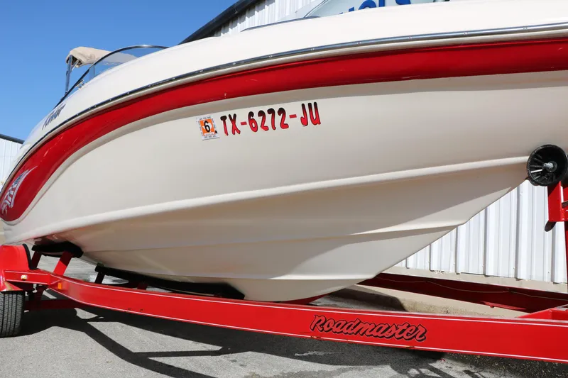 Slide: The Image of 2002 Rinker 192 Captiva Bowrider on red Roadmaster trailer, side view. - 14