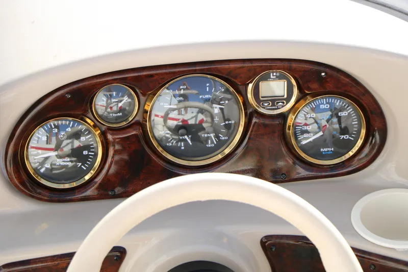 Slide: The Image of Dashboard of 2002 Rinker 192 Captiva Bowrider with gauges and controls. - 22