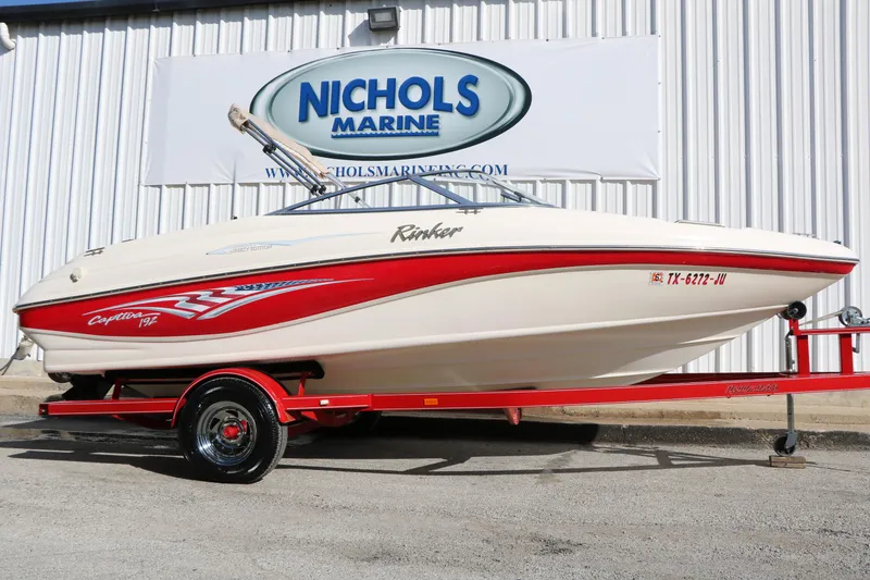 Slide: The Image of 2002 Rinker 192 Captiva Bowrider on red trailer at Nichols Marine. - 25