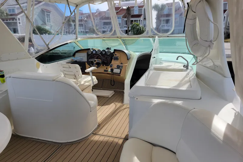 Slide: The Image of Interior of 2001 Carver 570 Voyager Pilothouse with helm and seating area. - 109