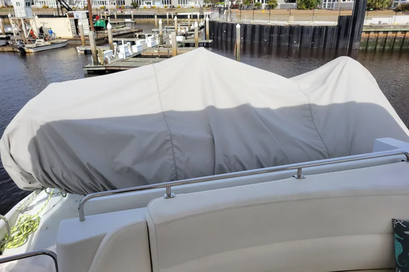 Slide: The Image of Covered area on a 2001 Carver 570 Voyager Pilothouse yacht at a marina. - 110