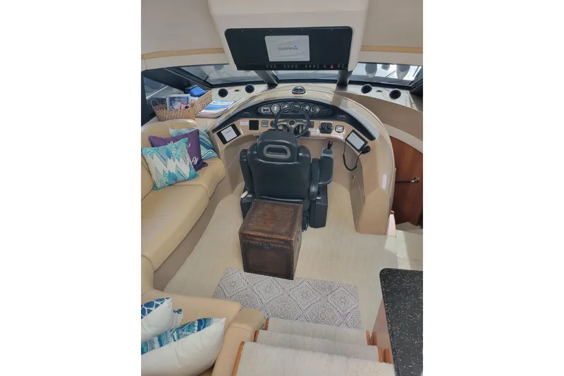Slide: The Image of Pilothouse interior of 2001 Carver 570 Voyager with helm, seating, and nautical decor. - 112