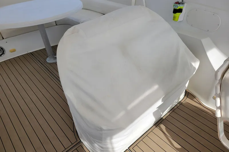 Slide: The Image of Covered seating area on 2001 Carver 570 Voyager Pilothouse boat deck. - 119