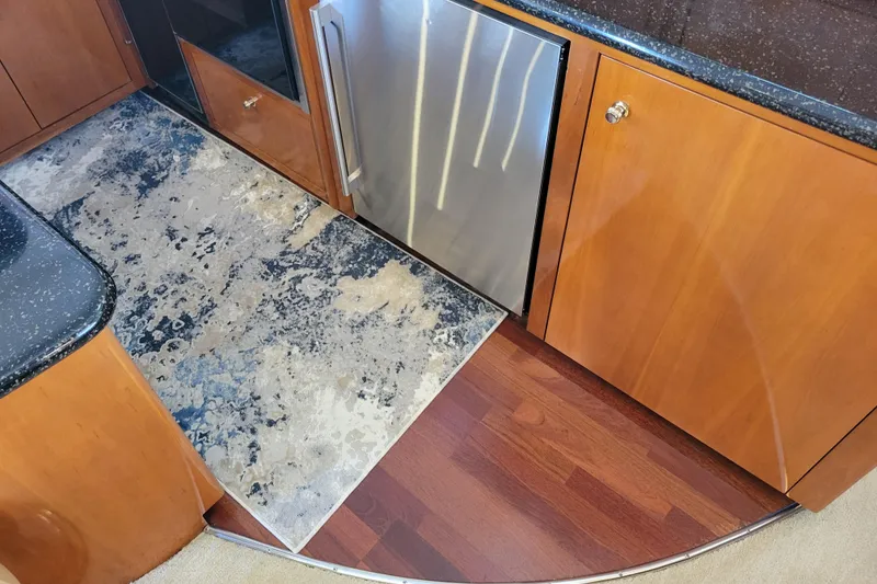 Slide: The Image of Interior of 2001 Carver 570 Voyager Pilothouse with modern kitchen design. - 12